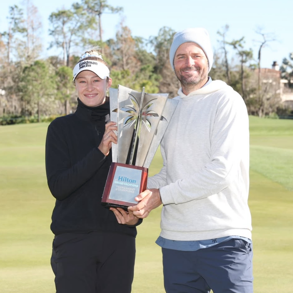 Hilton Grand Vacations ToC '26- LPGA Champion Nelly Korda and Celebrity Champion Mardy Fish holding trophy made by Malcolm DeMille